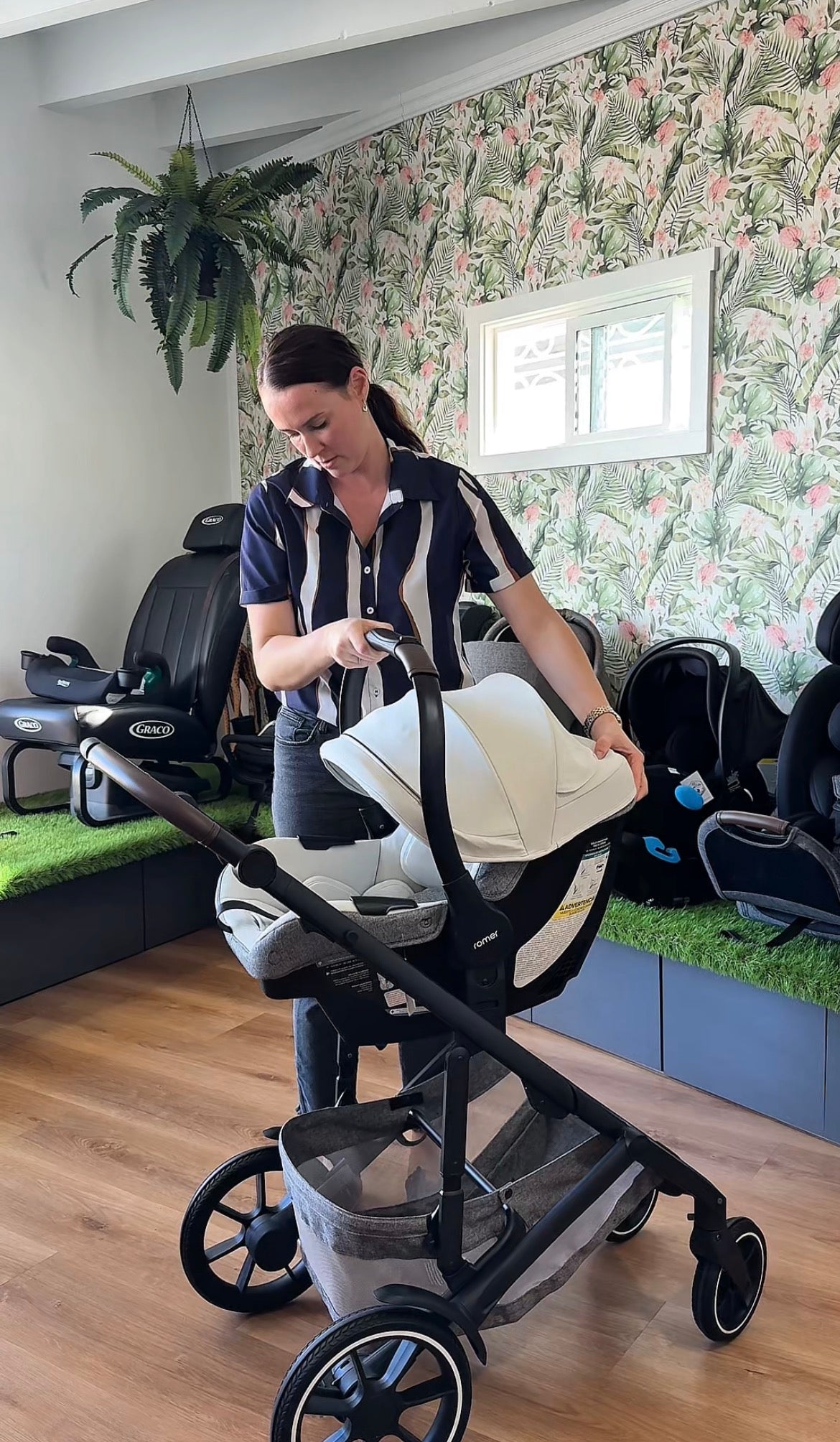 Child Passenger Safety Technician demonstrating a car seat